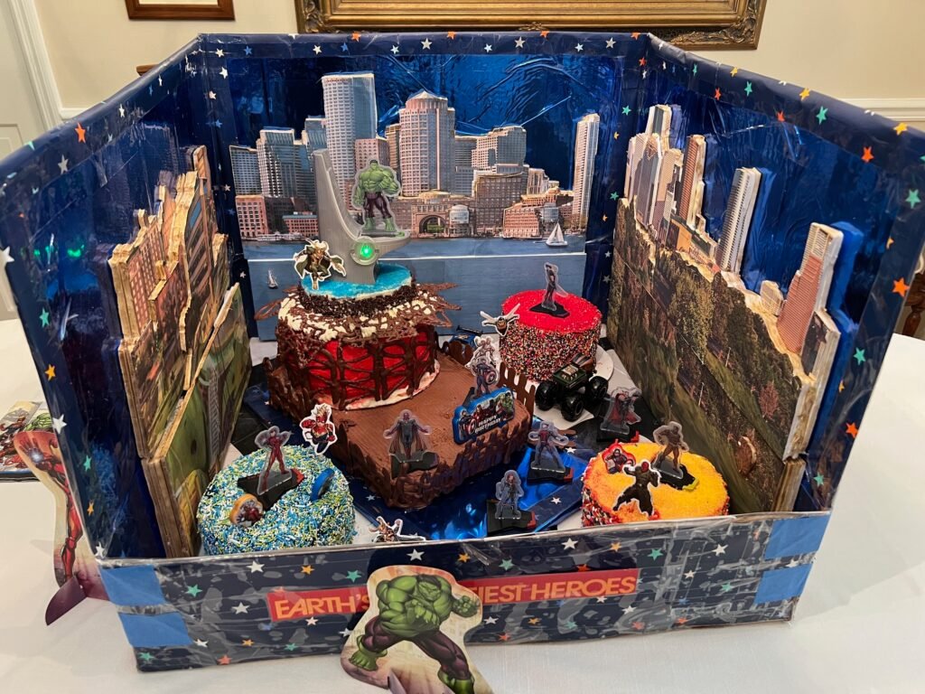 Custom Marvel themed diorama cake scene by Honey’s Baking Company