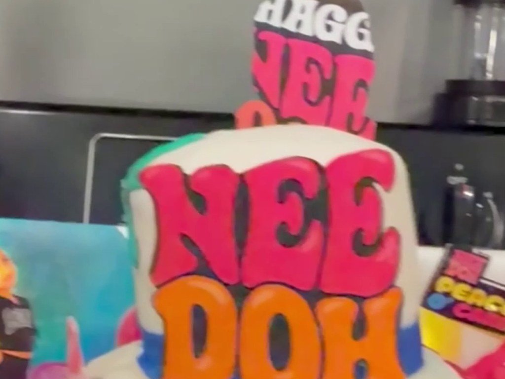 Custom NeeDoh themed cake with bold pink and orange lettering by Honey’s Baking Company