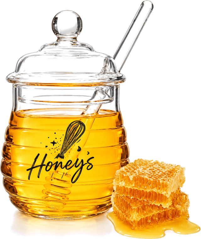 Honey’s Baking Company glass honey jar with a honey dipper and fresh honeycomb